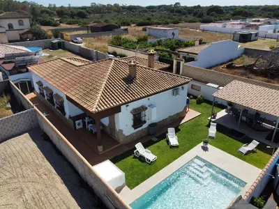 an aerial view of a house with a swimming pool at Chalet Santi Playa de la Barrosa in Chiclana de la Frontera