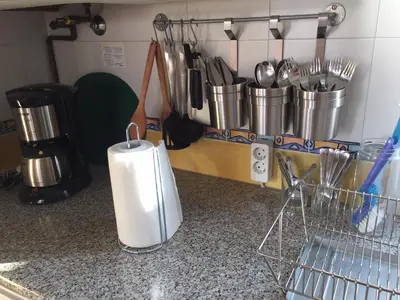 a kitchen counter with pots and utensils on it at La terraza de San Pedro in Cádiz