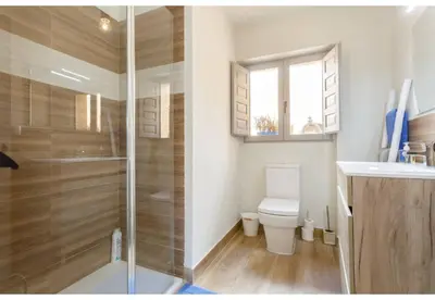 a bathroom with a shower and a toilet and a sink at TERRAZA-Caleta Beach Home by Cadiz4Rentals in Cádiz
