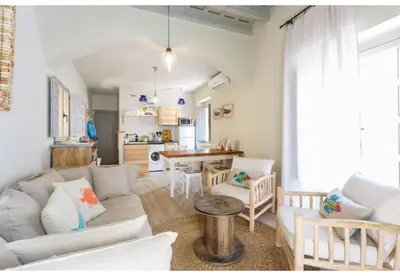 a living room with a couch and a table at TERRAZA-Caleta Beach Home by Cadiz4Rentals in Cádiz