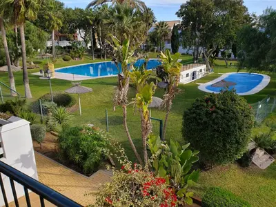 a view of the pool from the balcony of a resort at Coto la Campa in Chiclana de la Frontera