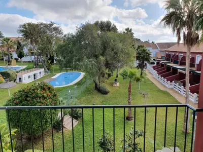 a view from a balcony of a resort with a swimming pool at Coto la Campa in Chiclana de la Frontera