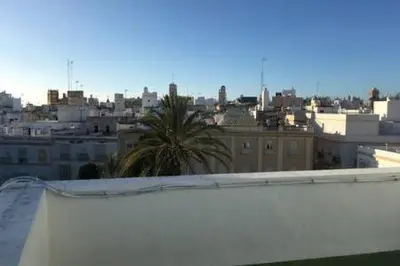 a view of a city from the roof of a building at Homestay en Plaza Candelaria, Casco Antiguo in Cádiz