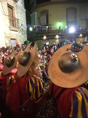 a group of people dressed in costumes with masks on their heads at Homestay en Plaza Candelaria, Casco Antiguo in Cádiz
