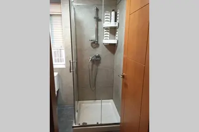 a shower with a glass door in a bathroom at Apartamento Plaza Viuda in Cádiz