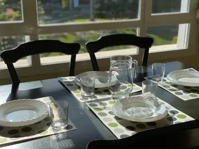 a table with plates and glasses on a table at Apartamento en Bahia Golf - Costa Ballena in Costa Ballena