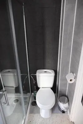 a small bathroom with a toilet and a shower at Miriam Costa de la luz in Jerez de la Frontera