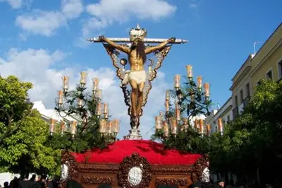 a statue of christ the redeemer on a red cloth at Miriam Costa de la luz in Jerez de la Frontera