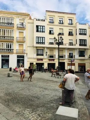 a group of people standing in front of a building at Apartamentos Valverde Cádiz 1-B in Cádiz