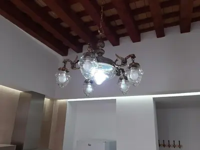 a chandelier hanging from a ceiling in a room at Apartamentos Valverde Cádiz 1-C in Cádiz