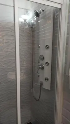 a shower stall with a shower head and a shower at Casa Arco de la Pastora in Medina Sidonia