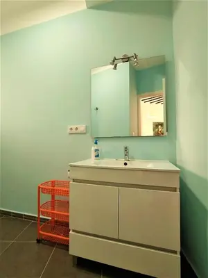 a bathroom with a sink and a mirror at Sol de Cádiz in Cádiz