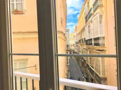 a view of a city street from a window at Sol de Cádiz in Cádiz