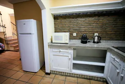a kitchen with a white refrigerator and a microwave at Duplex 6 pax con Wifi en Bahia Sur con parking y piscinas comunitarias in San Fernando