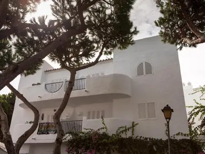 a large white building with trees in front of it at Pinar de Don Jesus Sagitario in Campano