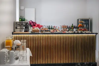 a table with a buffet of food and drinks at Hotel Boutique Palacio Corredera in Jerez de la Frontera