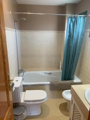 a bathroom with a toilet and a bath tub at El Anfitrión - Mirador de los Navegantes in Sanlúcar de Barrameda