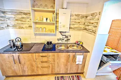 a small kitchen with a sink and a counter at Plaza de Toros 3-Bedroom Apartment with Balcony in El Puerto de Santa María