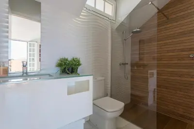 a bathroom with a toilet and a sink and a shower at Casa Don Camilo Costa Ballena in Costa Ballena