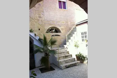 a stairway leading up to a brick building at Casa Florinda #1 in Jerez de la Frontera