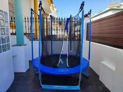 a trampoline in the middle of a room at CASA DE DISEÑO EN LA PLAYA. in Rota