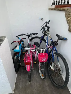 three bikes are parked next to a wall at CASA DE DISEÑO EN LA PLAYA. in Rota