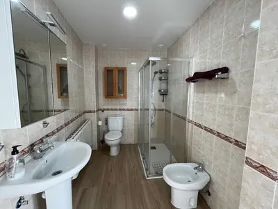 a bathroom with a sink and a toilet and a shower at Plaza Libertad Grupo AC Gestion in Cádiz