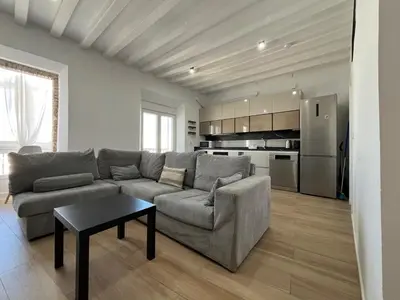 a living room with a couch and a table at Plaza Libertad Grupo AC Gestion in Cádiz