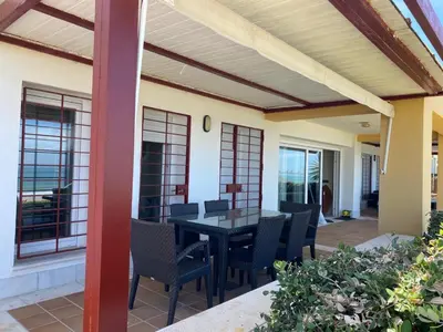 a patio with a table and chairs on it at Altair 11 in El Puerto de Santa María
