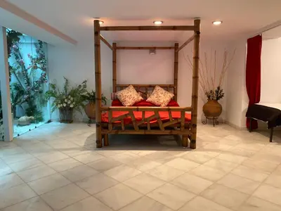 a bed with pillows on it in a room at Altair 11 in El Puerto de Santa María