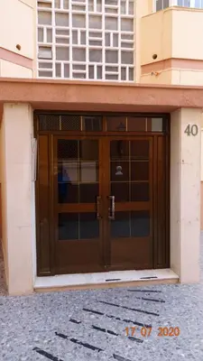 a pair of doors on a building at Apartamento Fenicia con aparcamiento incluido Vistas al mar in Cádiz