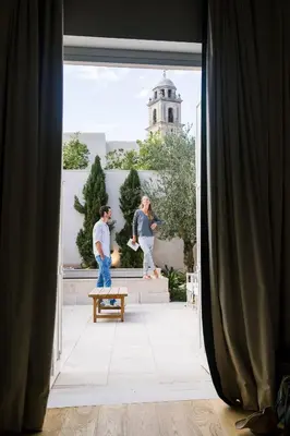 a man and a woman standing in a doorway at Hotel Bodega Tio Pepe in Jerez de la Frontera
