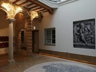 a room with a painting on the wall and a rug at LOFTS MIRIAM CONDE O,REILLY in Cádiz