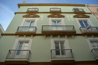 a tall white building with balconies on it at LOFTS MIRIAM CONDE O,REILLY in Cádiz