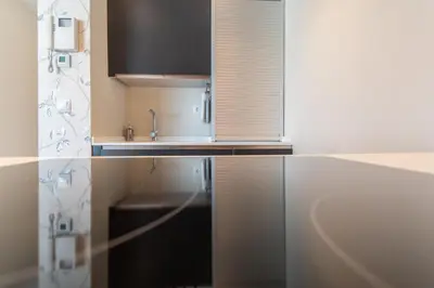 a kitchen with a sink and a counter top at Phoenix Luxury Loft Cádiz in Cádiz