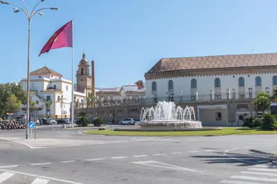 a building with a fountain in the middle of a street at Phoenix Luxury Loft Cádiz in Cádiz