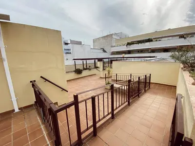 a balcony with a railing on a building at Beautiful & Cozy Apart. Pool & Parking-Downtown in Sanlúcar de Barrameda