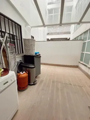 an empty room with a hard wood floor in a building at Beautiful & Cozy Apart. Pool & Parking-Downtown in Sanlúcar de Barrameda