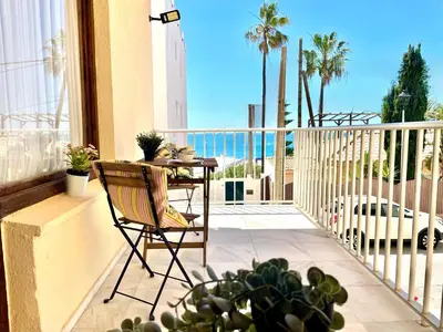 a balcony with a table and a view of the ocean at GATU Villa Cielo y Mar junto la playa, terraza , wifi y vista al mar ,
