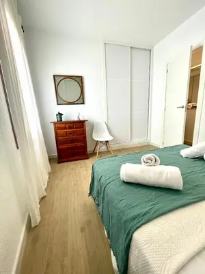 a bedroom with a bed with a towel on it at GATU Villa Cielo y Mar junto la playa, terraza , wifi y vista al mar ,