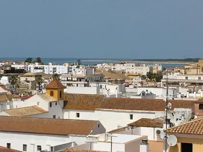 a view of a city with white buildings at Bonito Ático en el centro de la ciudad in Sanlúcar de Barrameda