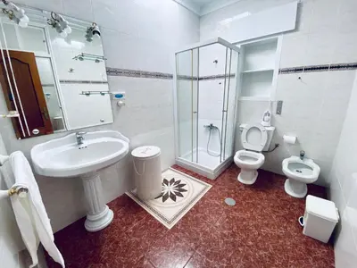 a bathroom with a sink and a toilet and a shower at Ramón y Cajal 6 in Chipiona