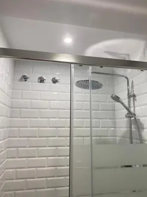 a shower with a glass door in a bathroom at Atico Loft The Rose 48 in Cádiz