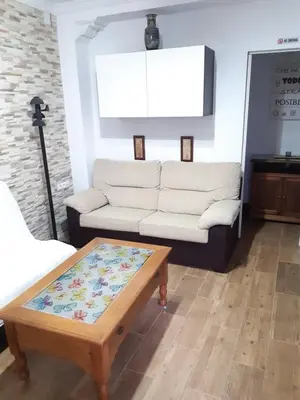 a living room with a couch and a coffee table at Apartamento Zona Carrefour in El Puerto de Santa María