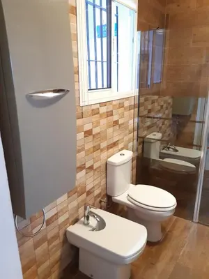 a bathroom with a toilet and a sink at Apartamento Zona Carrefour in El Puerto de Santa María