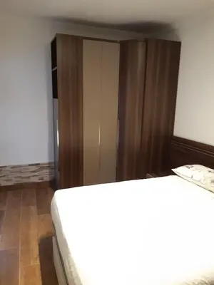 a room with two beds and a closet at Apartamento Zona Carrefour in El Puerto de Santa María