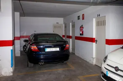 a car parked in a garage with two stalls at Sanlucar Misericordia Centro in Sanlúcar de Barrameda