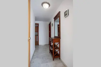 a hallway with a mirror and a dressing room at Sanlucar Misericordia Centro in Sanlúcar de Barrameda