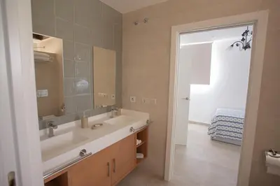 a bathroom with a sink and a mirror at El Tesorillo II in Arcos de la Frontera