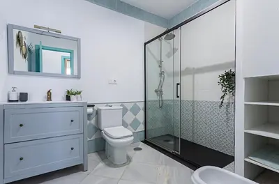 a bathroom with a toilet and a glass shower at Sibilina House centro Jerez in Jerez de la Frontera